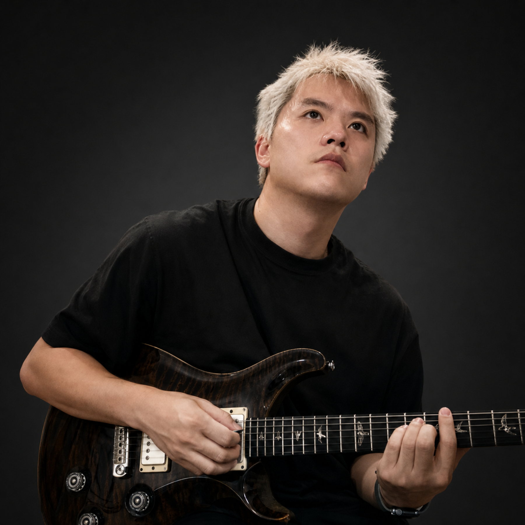 Bryan Bian playing guitar